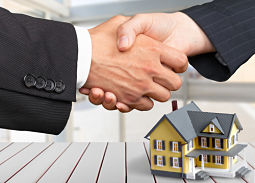 shaking hands with small house in background, lake county attorney