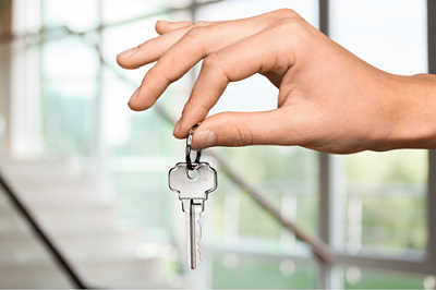small business attorney, hand with key to a small business